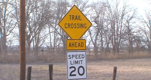 Trail crossing sign posted near site of fatal July crash on Katy Trail