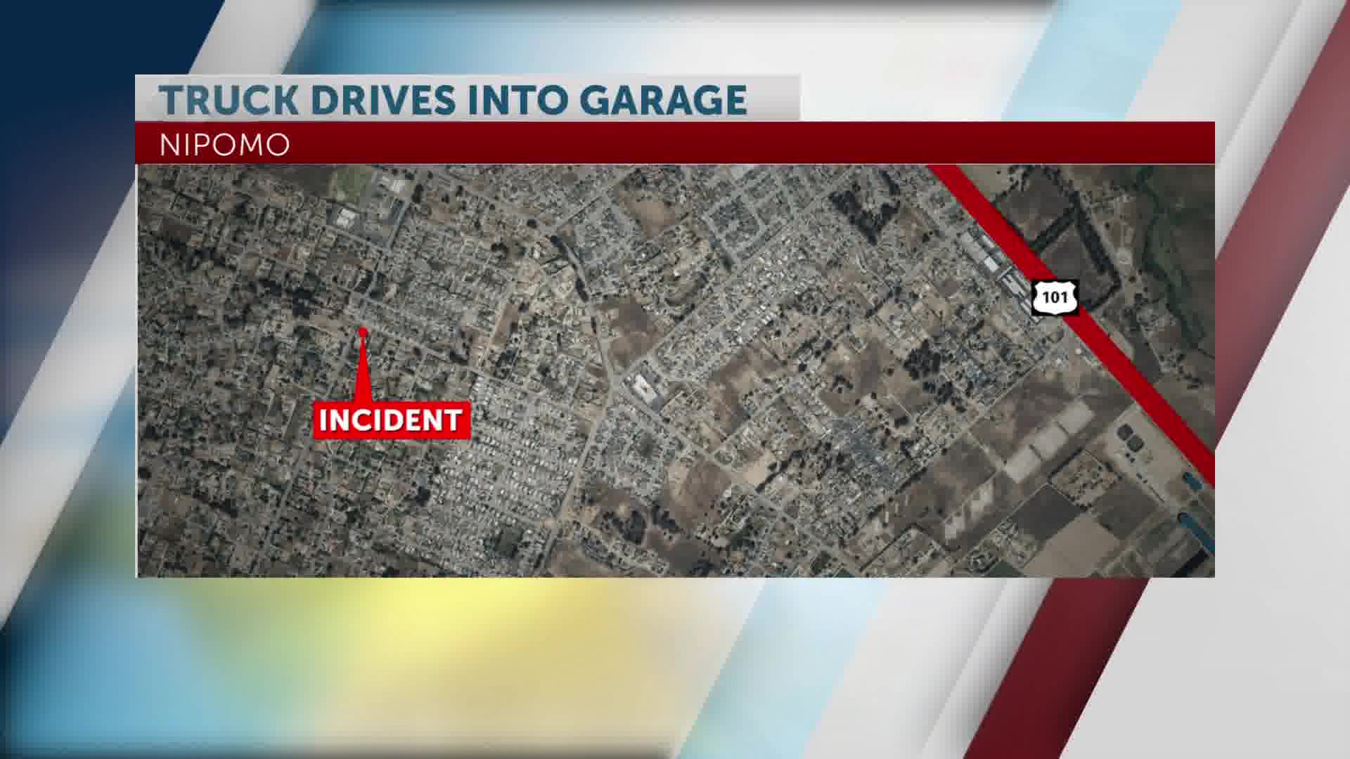 Truck driver injured after car goes through fence into garage; building tagged for inspection