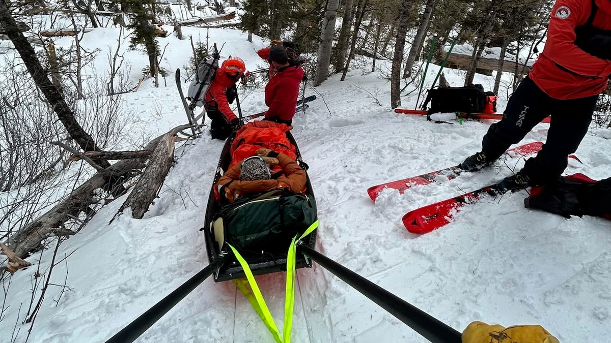 25 Volunteers brave slick conditions to rescue injured skier