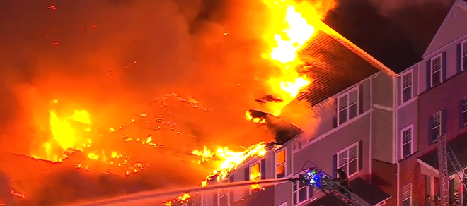 The fire burned through the attached homes at The Red Rock Preserve on Old York Road just before 5:45 a.m.
