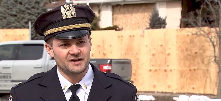 A daring rescue was caught on camera when an off-duty officer ripped down a fence to get into a back yard to help save two girls and their mother from a fire.