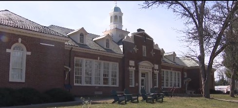 A man has been charged after allegedly secretly filming two women with a hidden camera in a restroom at a public library in Cohasset