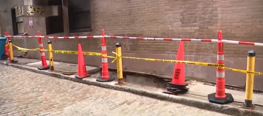 A worker was injured early Friday when he fell down an old coal chute outside the Omni Parker Hotel in Boston.