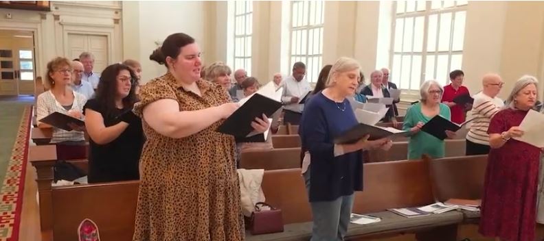 A group of local singers is preparing for a once-in-a-lifetime journey overseas
