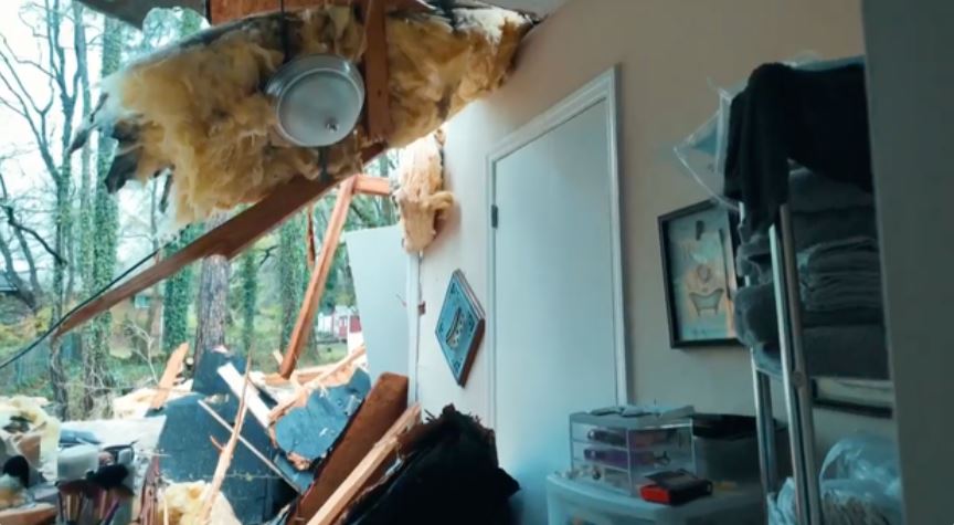 Some of the destruction inside the Steave Southwest Atlanta home after a tree fell on it during severe storms Monday