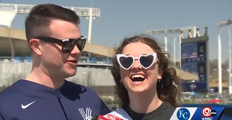 Sporting sunglasses that said "Just Engaged" and a matching sash to go with her new engagement ring