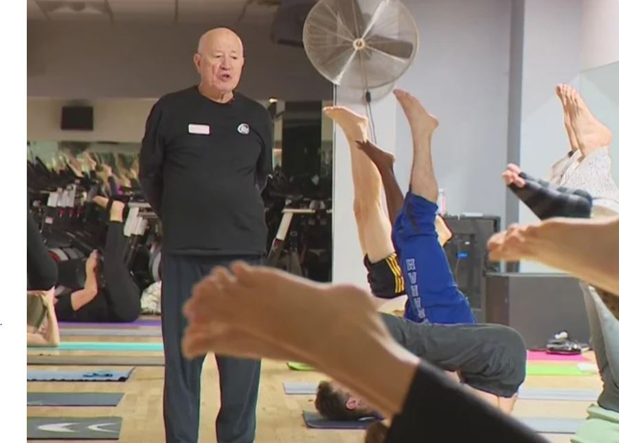 Salomon "Raghavan" Delgado leads yoga instruction at the Santa Monica 24 Hour Fitness.