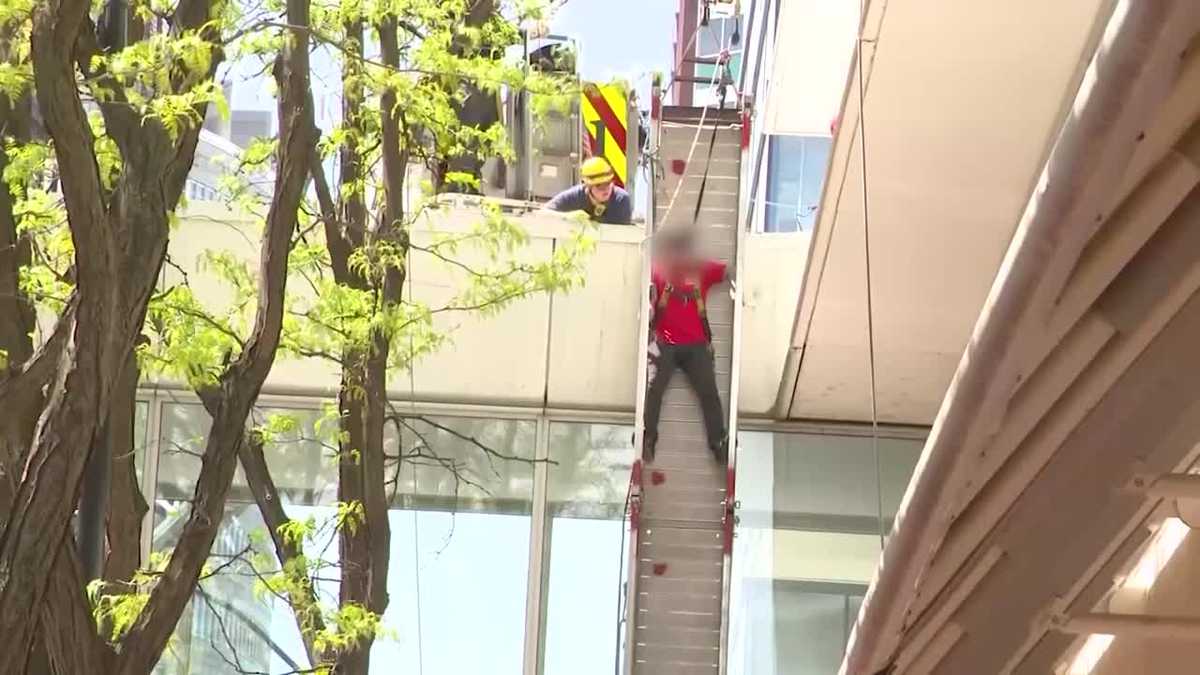First responders found a man with serious injuries and a second man trapped on a collapsed window-washing platform.