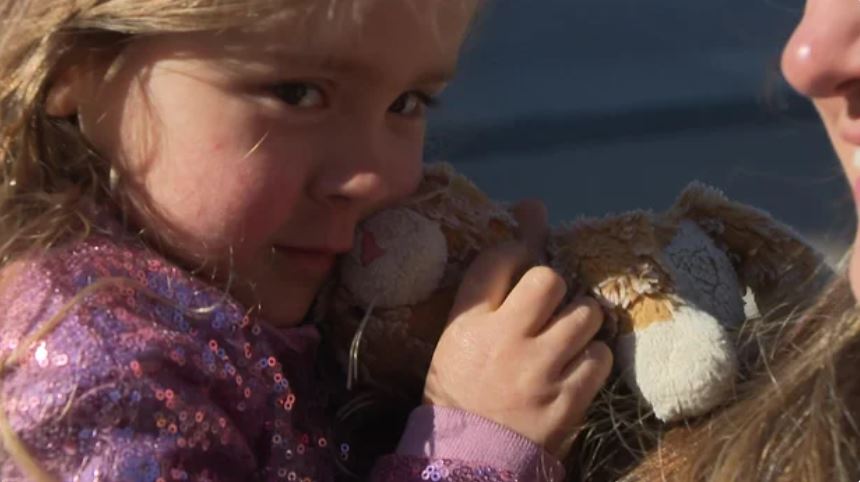 A mother and her three-year-old daughter were among the thousands cheering for the Boston Marathon runners on Boylston Street on Monday