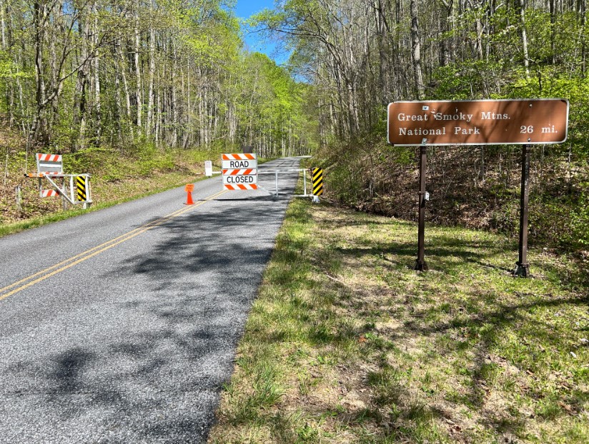FILE - A "road closed" sign and gate at US-74 along the Blue Ridge Parkway. Rangers said the road was temporarily closed between mileposts 443 and 455 in an effort to capture two stray dogs and take them to a shelter.