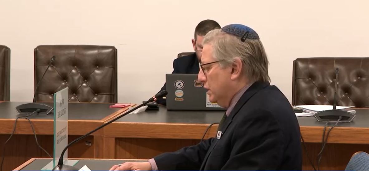 A committee at the State House is considering whether to discipline or expel a state representative from Weare over a social media post targeting a fellow lawmaker and invoking a Nazi term for the systemic extermination of Jewish people.