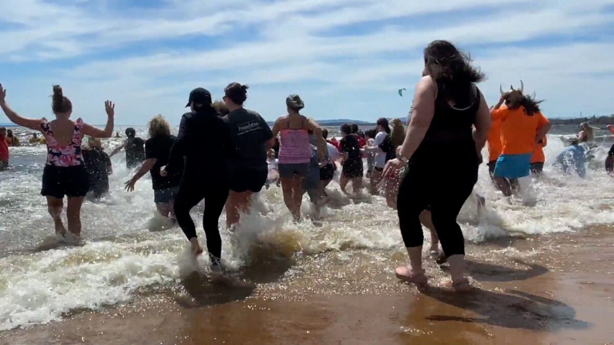 Hundreds of people took the polar plunge in Plattsburgh on Saturday to support Special Olympics New York.