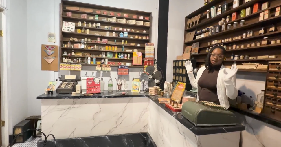 Kyler Hendricks is suited in white gloves as she cleans