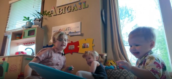 Two-year-old Hudson loves to play games with his sisters