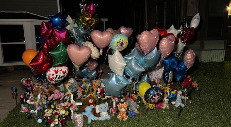 Community members have spent the days following the shooting adding to a makeshift memorial to honor the young lives lost.