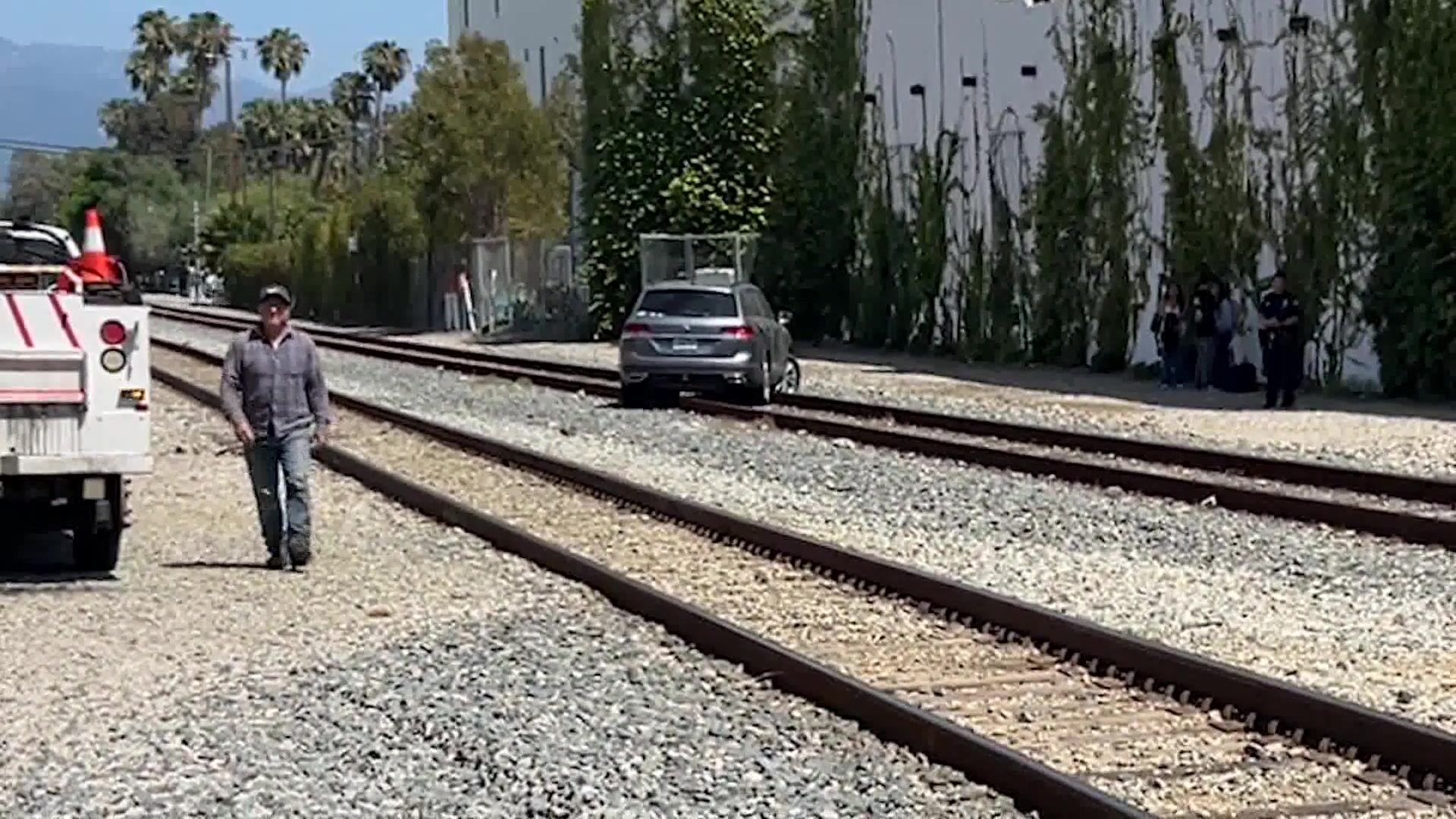 Crews Work to Remove Vehicle Stuck on Amtrak Tracks