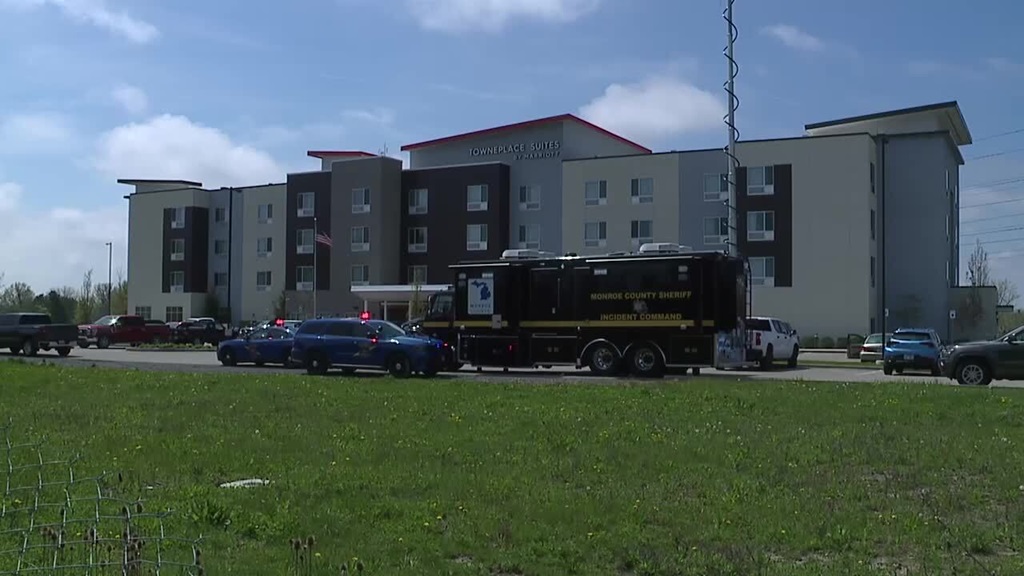 A person armed with a knife was shot and killed by a Monroe County sheriff's deputy on Sunday morning