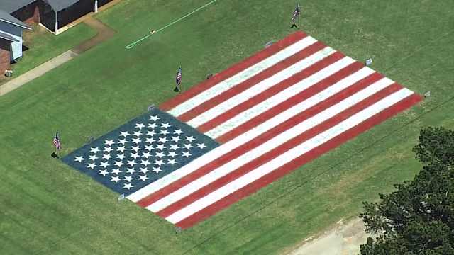 An Oklahoma family is showing off their patriotism and honoring 250 years since America declared independence from England by painting a giant American flag in their yard.