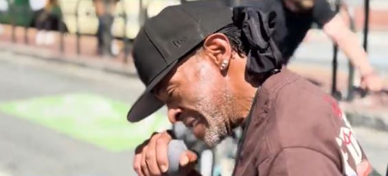 Opera singer Tim Blevins performs regularly outside San Francisco's Orpheum Theatre
