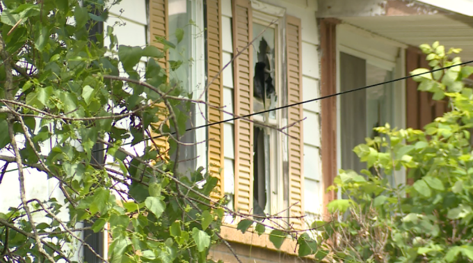Window busted in the home the suspect was shooting out of.