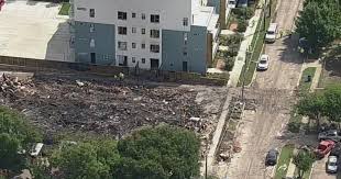 A large explosion and fire at a Dallas apartment building Thursday killed three people