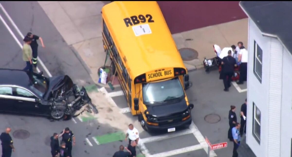 Nine students were taken to the hospital as a precaution after a car struck a school bus in Everett