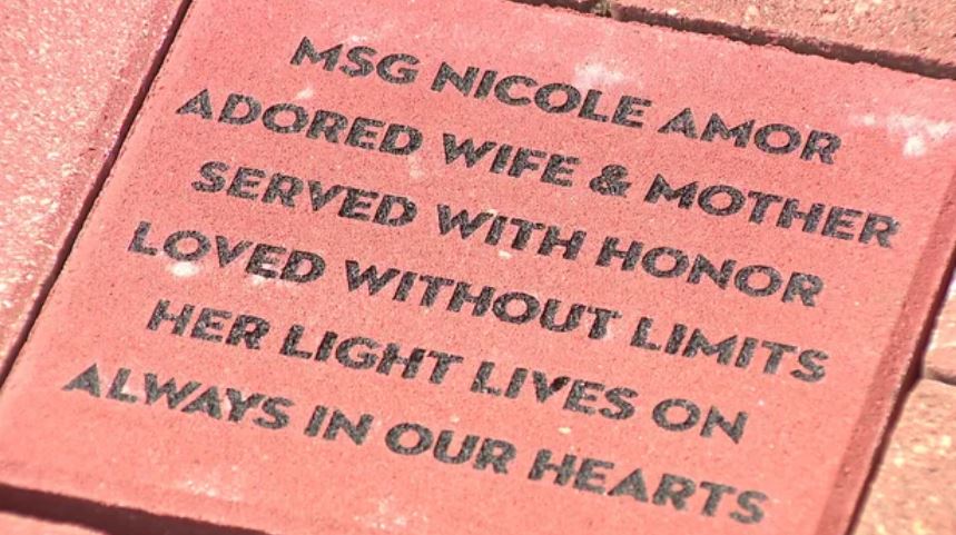 A memorial stone in honor of Master Sergeant Nicole Amor