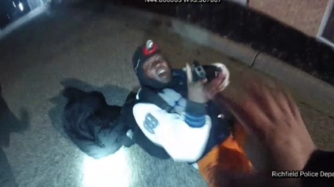 A frame from footage captured by Sgt. Mario Leon's body-worn camera that shows the moment Desaver Hollis shot him in the hand.