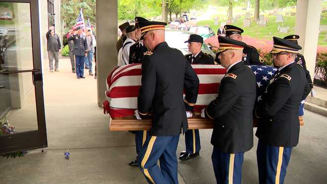 Army Cpl. Charles Carroll Jr. was laid to rest Friday next to his mother