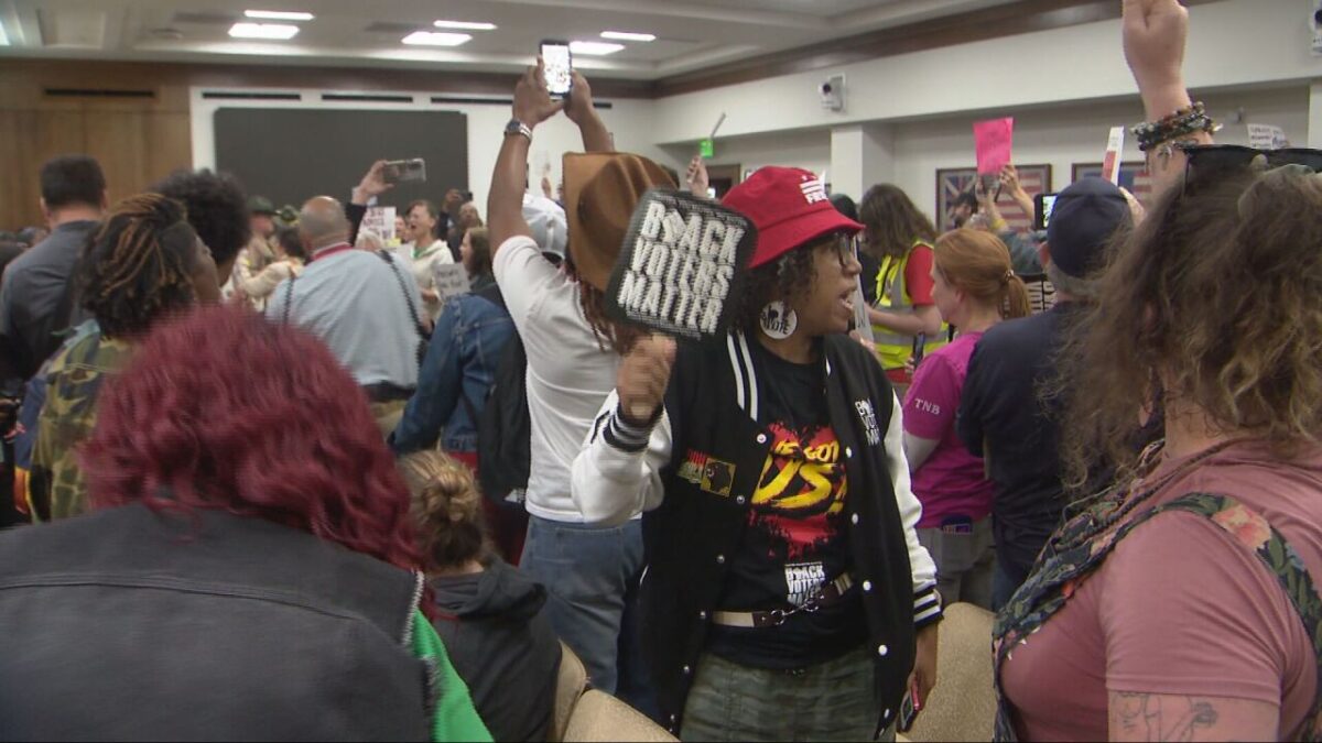 Members of the audience protest over legislation that would change Tennessee's Congressional map
