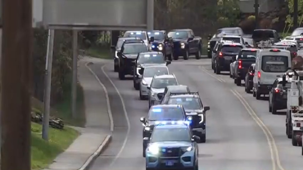 A procession was held Wednesday morning to escort the body of Maine Game Warden Joshua Tibbetts