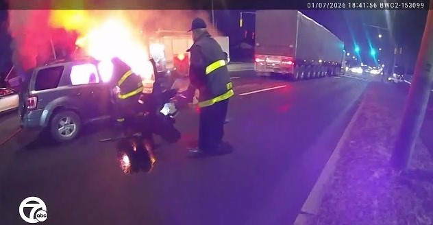 Body camera footage captured the moment a Detroit firefighter risked his life to pull a woman from a burning SUV on the city's west side.