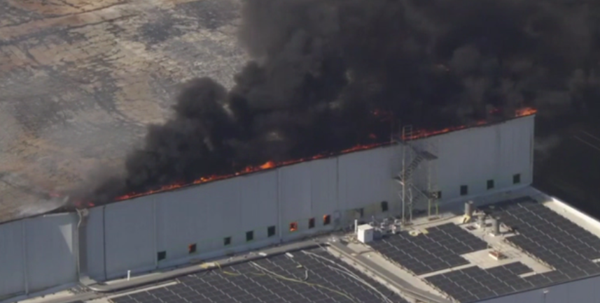 Smoke billowing from the cold storage facility in Boyle Heights on Saturday