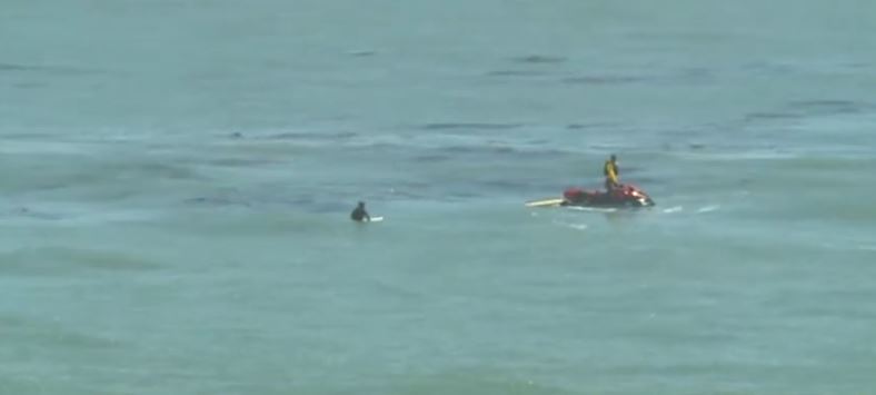 Two people were rescued Wednesday afternoon after rising tides swept them into the water near Yellow Bank Beach