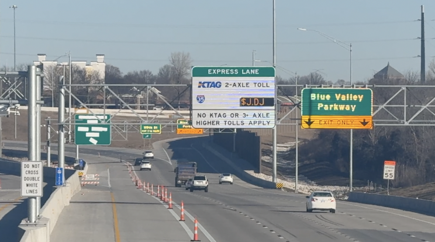 Orange cones and message boards line the new express lanes on Highway 69 as final construction wraps up. The Kansas Department of Transportation says the lanes could open by the end of February
