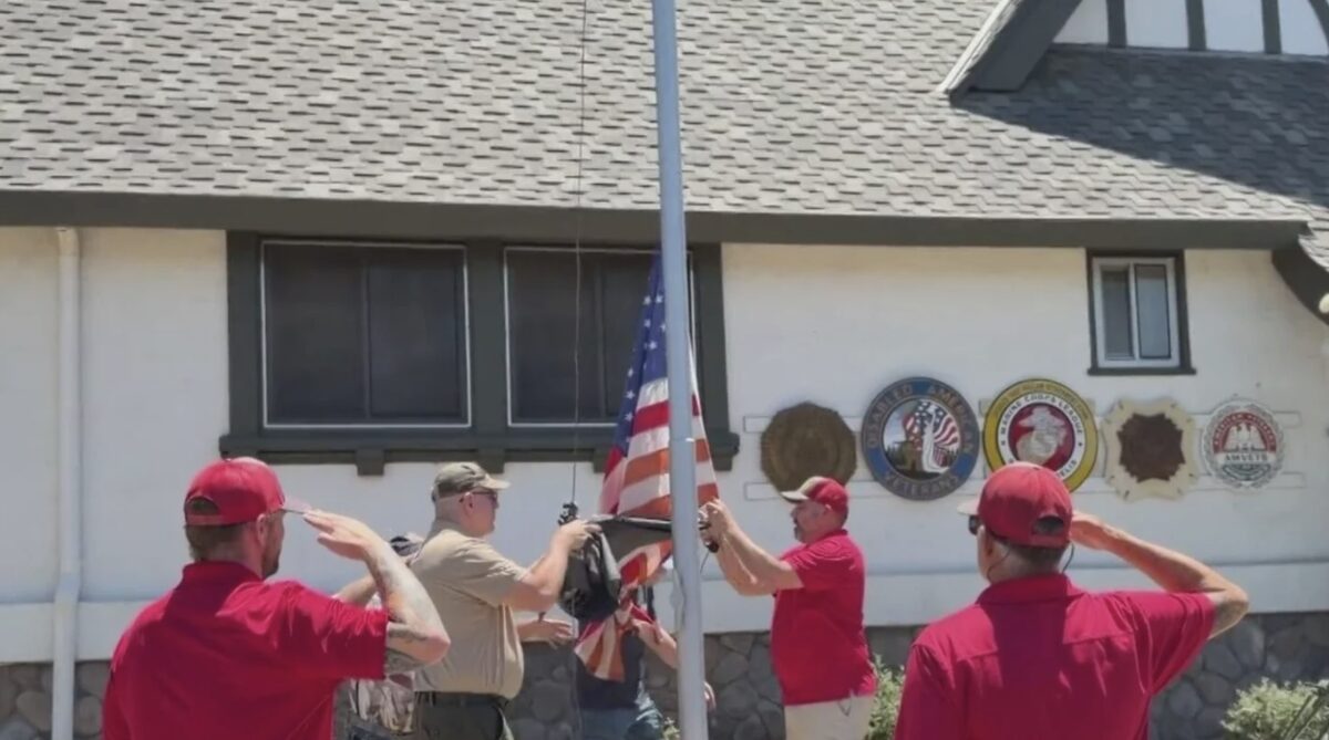 Rory Nichols organized a day where 26 volunteers came together to replace American tattered and torn flags with brand new ones