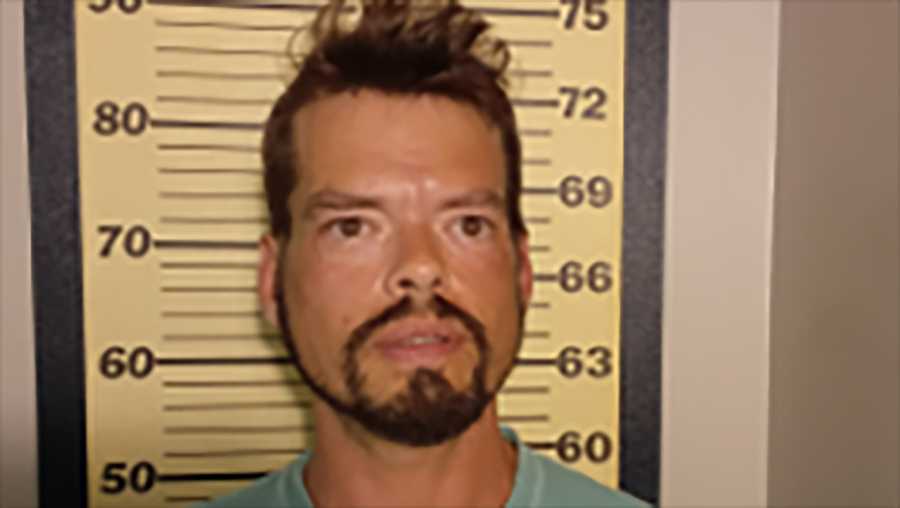 John Michael Beall is accused of throwing a cash register at a Taco Bell employee.