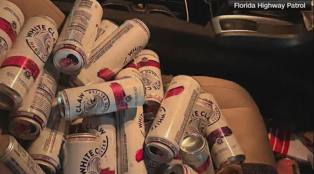 Dozens of open White Claw cans were found on the passenger seat of a car after the driver was pulled over in Pasco County
