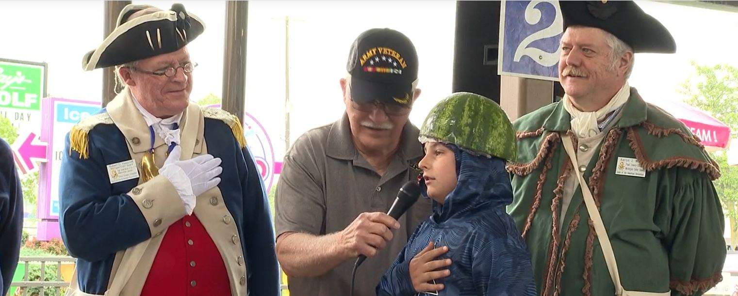 A Fenton ice cream store celebrated Flag Day with a unique challenge: kids who recite the Pledge of Allegiance in front of a crowd win free ice cream and mini-golf tickets.