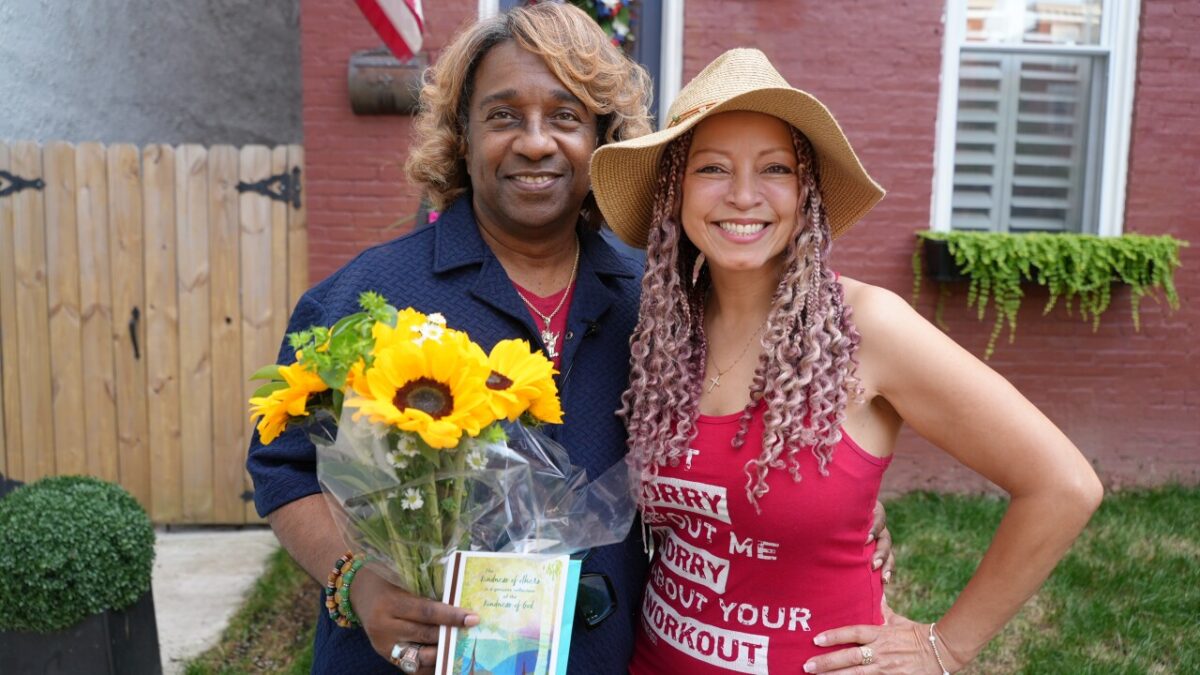 Chip and Jiri outside of her house.