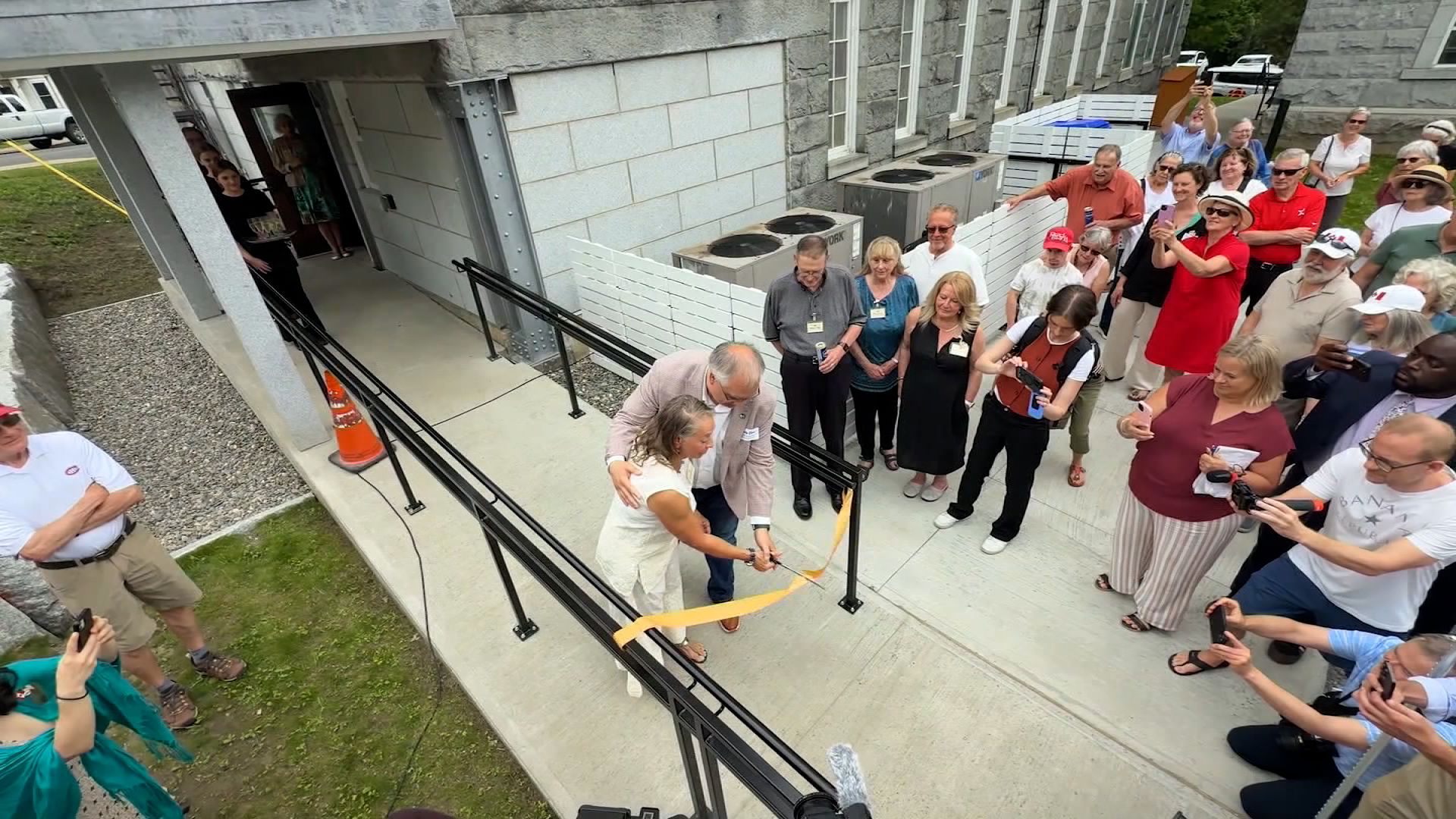 Community leaders from both sides of the U.S.-Canada border gathered to celebrate the opening of a new Canadian entrance at the Haskell Free Library and Opera House.
