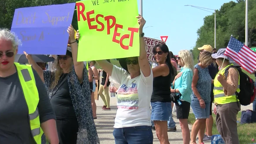 Around 30 protesters lined the sidewalk across from Angelini's Ristorante in Onalaska on Saturday in response to a viral video in which the restaurant's owner used derogatory language while explaining why he prefers hiring male servers over female servers.