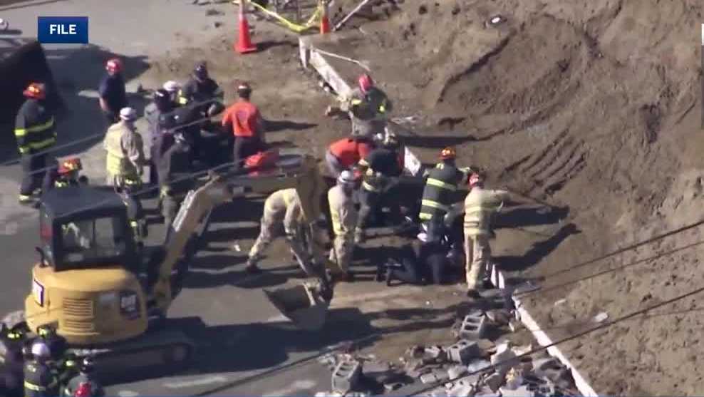 FILE - A 54-page complaint describes the moment a 12-foot retaining wall toppled over in 2021