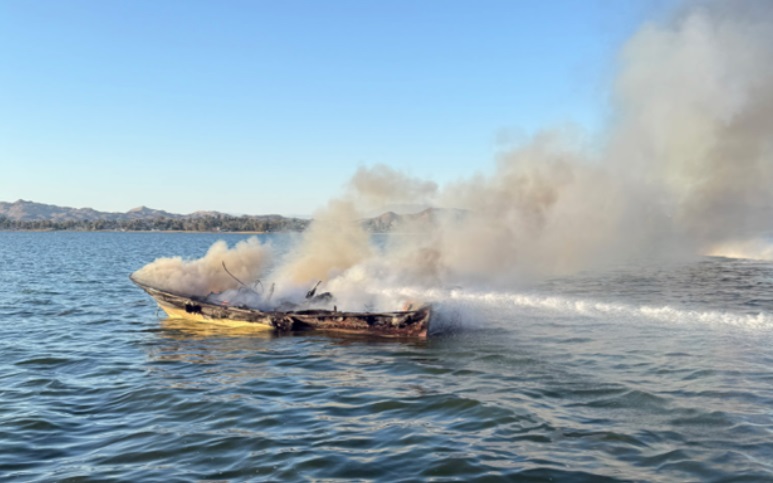 The burning boat in the middle of Lake Elsinore on Saturday