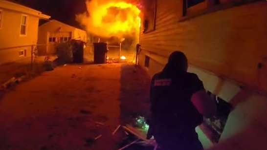 Omaha police released photos from body-worn cameras showing the officers who quickly jumped into action to save a 4-year-old boy from a house fire on Tuesday morning.