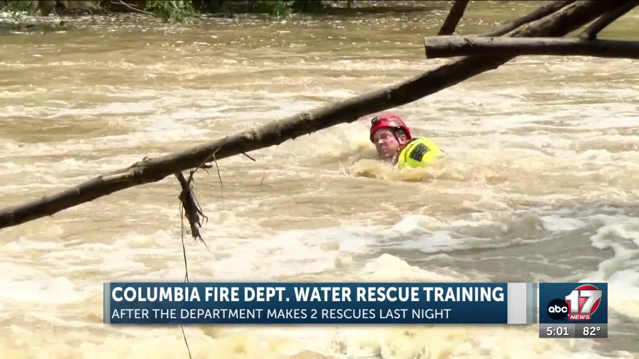 Columbia firefighters train at Hinkson Creek as flooding on roads continue around the area