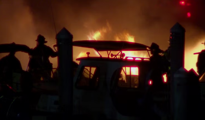 Winthrop Fire Department Chief Stephen Calandra said the fire spread from one boat to another from gasoline that was on top of the water.