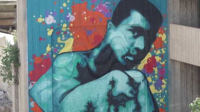 Volunteers planted fruits and vegetables on Wednesday in Louisville’s Smoketown neighborhood at a site tied to Muhammad Ali’s early life