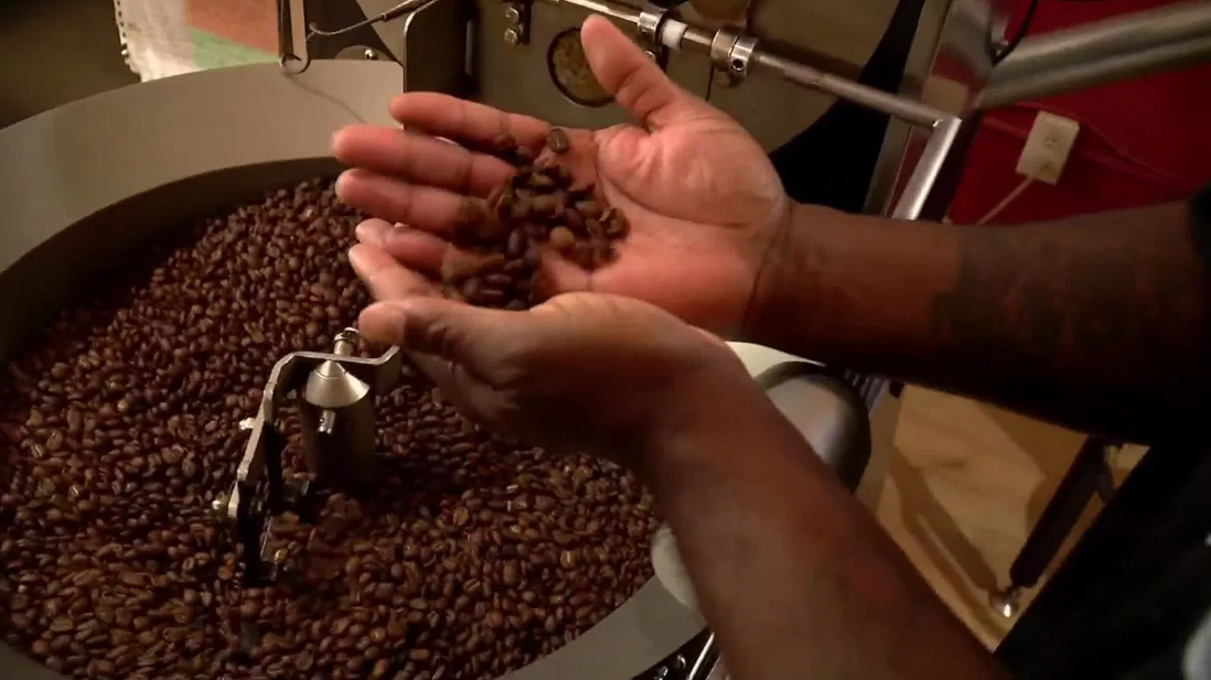 Workers at Deep Time Coffee roast coffee beans. Deep Time Coffee is a nonprofit coffee enterprise in Asheville