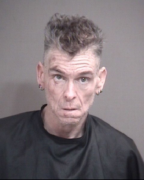Man who allegedly pointed guns at passing cars before standoff charged with felonies